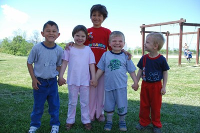 Five children outside smiling, Serbia