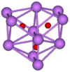  The stick and ball diagram shows three regular octahedra which are connected to the next one by one surface and the last one shares one surface with the first. All three have one edge in common. All eleven vertices are purple spheres representing caesium, and at the center of each octahedron is a small red sphere representing oxygen.
