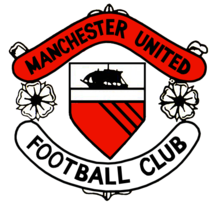 A football crest. In the centre is a shield with a ship in full sail above a red field with three diagonal black lines. Either side of the shield are two stylised roses, separating two scrolls. The upper scroll is red and reads 