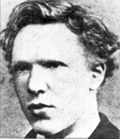 Headshot photo of the artist as a cleanshaven young man. He has thick, ill-kempt, wavy hair, a high forehead, and deep-set eyes with a wary, watchful expression.