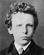 black and white formal headshot photo of the artist as a boy in jacket and tie. He has thick curly hair and very pale-colored eyes with a wary, uneasy expression.