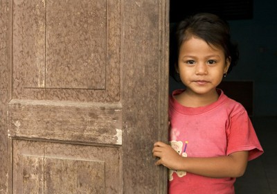 A girl behind a door - Indonesia