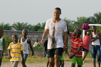 Footballer Vincent Kompany playing with children from SOS Children's Village Kinshasa