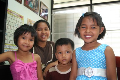 Three children and a mother, Thailand