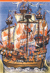 Dos grandes veleros acostado de lado a lado, una delante de la otra, devastadas por el fuego