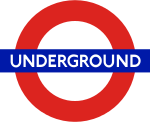 Metro de Londres redondel, un logo hecho de círculo rojo con una barra horizontal azul.