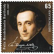 postage stamp showing on a dark background a head-and-shoulders portrait of a dark-haired, narrow faced, middle-aged man looking out at the viewer, weating a high collar and dark coat; text comprises 'Felix Mendelssohn Bartholdy', the dates 1809-1847, a facsimile of Mendelssohn's signature,the figure 65 and the word 'Deutschland'