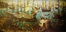 Une petite flotte de grands caraques, décorés sont à cheval sur une mer ondulée. Au premier plan, deux, tours fortifiées bas hérissés de canons et des soldats armés et cortège à pied entre eux.