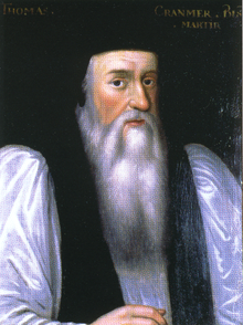 Portrait de l'archevêque Cranmer comme un homme âgé. He has a long face with a flowing white beard, large nose, dark eyes and and rosy cheeks. He wears clerical robes with a black mantle over full white sleeves and has a doctoral cap on his head