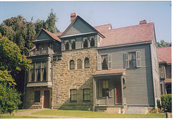 A large three story house of wood and stone
