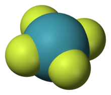 Um modelo de molécula química planar com um átomo azul centro (Xe) simetricamente ligado a quatro átomos de periféricos (flúor).
