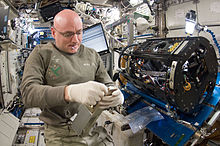 NASA astronaut Scott Kelly, Expedition 26 commander, works on the Combustion Integrated Rack (CIR) Multi-user Drop Combustion Apparatus (MDCA) in the Destiny laboratory of the International Space Station.