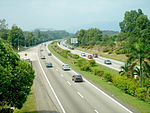 A dual highway with greenery on either side